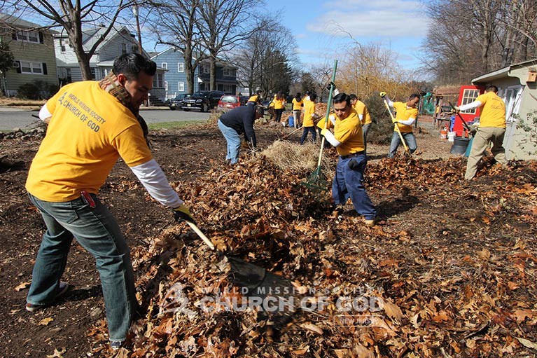 Mother's Love Growing in the Community Gardens Raking Leaves