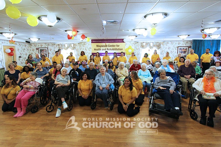 Cheering Up Residents at Maywood Center for Health and Rehab Group Shot